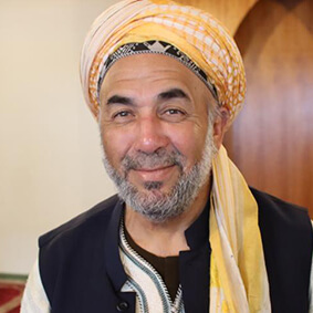 A man with a beard and turban on